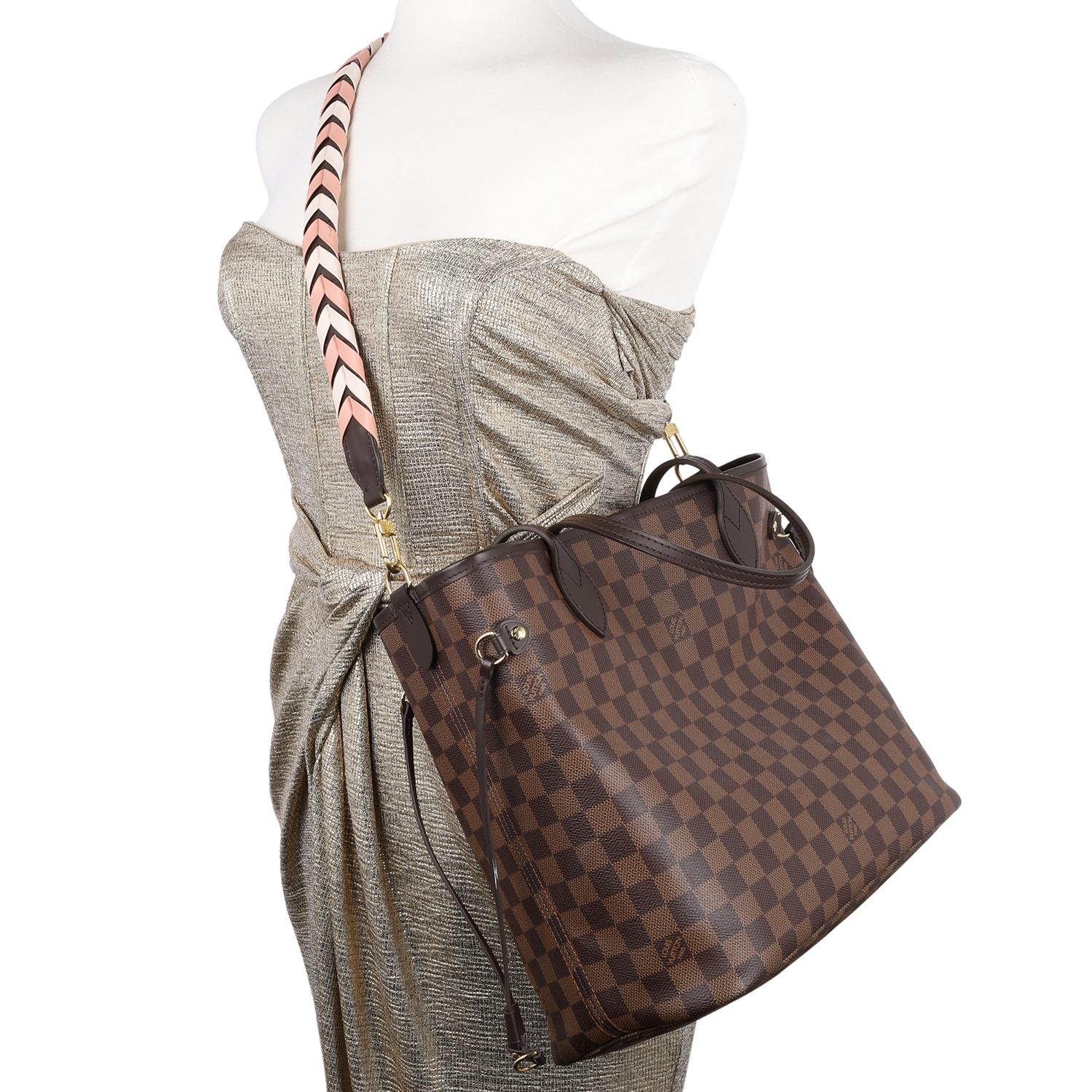 Authentic, pre-owned Louis Vuitton Brown Damier Ebene Neverfull MM tote bag with additional braided pink and white strap. This stylish tote is crafted of classic Louis Vuitton canvas. Features complimentary leather shoulder straps, additional pink