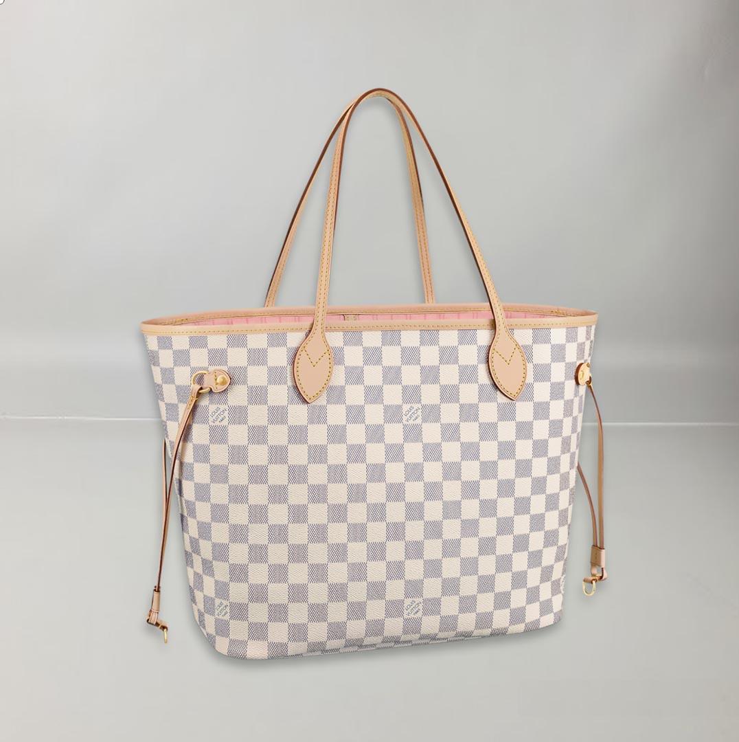 The Neverfull MM tote unites timeless design with heritage details. Made from fresh Damier Azur canvas with natural cowhide trim, it is roomy yet not bulky, with side laces that cinch for a sleek allure or loosen for a casual look. The slim leather