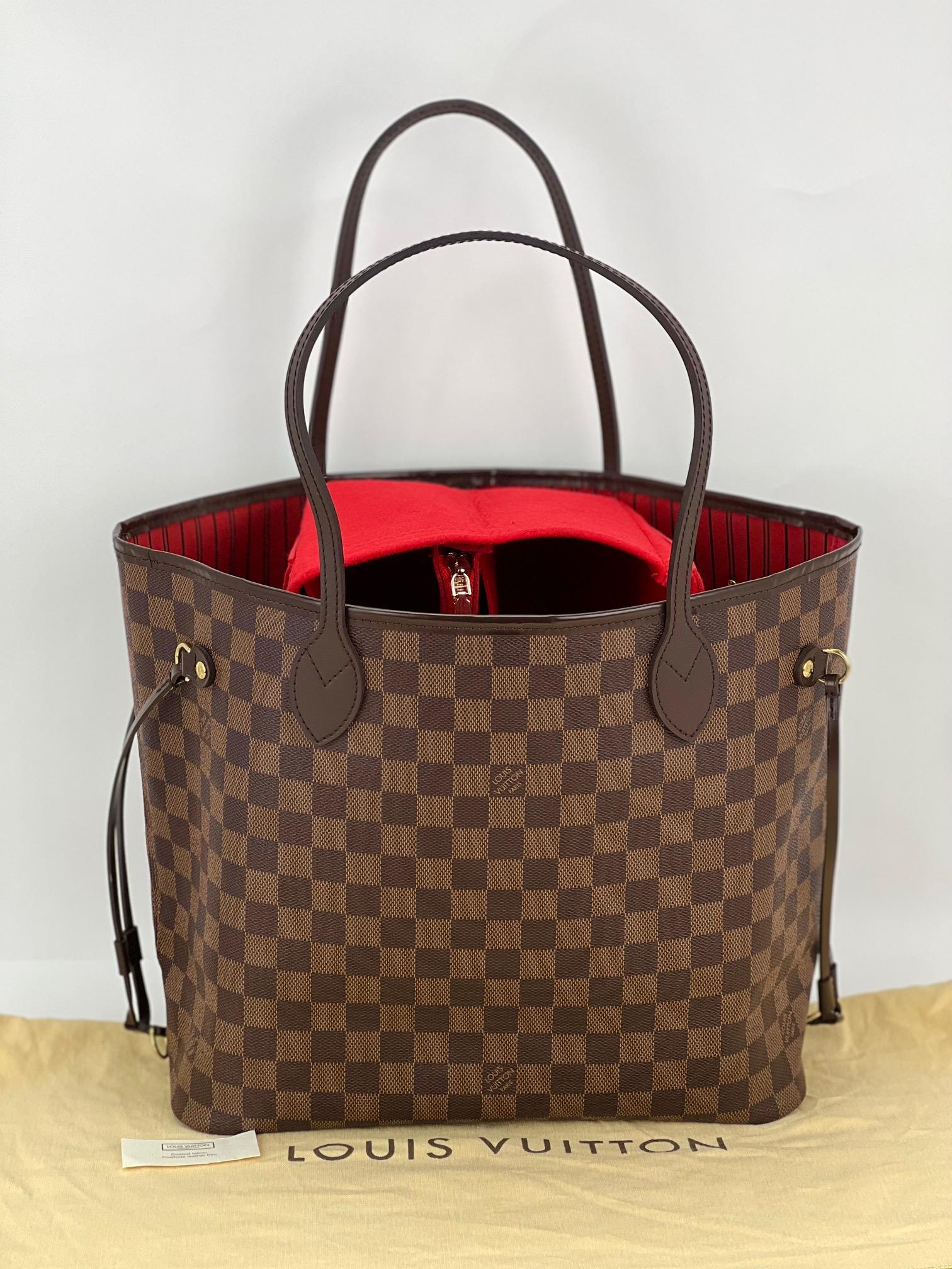 100% Authentic  Pre-Owned 
  Louis Vuitton Neverfull MM Damier Ebene 
W/Organizing insert to help keep bag upright.   
RATING: A  B  very good, well maintained, shows 
minor signs of wear
HANDLES: leather, they are stiff, tiny sign of use
on 1 strap