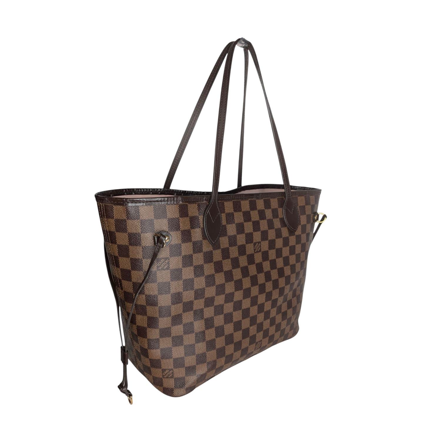 This chic tote is crafted of classic Louis Vuitton Damier in brown on coated canvas. The shoulder bag features chocolate brown cowhide leather trim, shoulder straps, side cinch cords, and has polished brass hardware. The top is open to a striped
