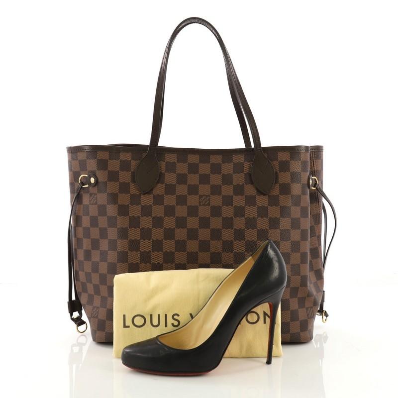 This Louis Vuitton Neverfull NM Tote Damier MM, crafted in damier ebene coated canvas, features dual slim handles, side laces, and gold-tone hardware. Its wide open top showcases a red fabric interior with side zip pocket. Authenticity code reads: