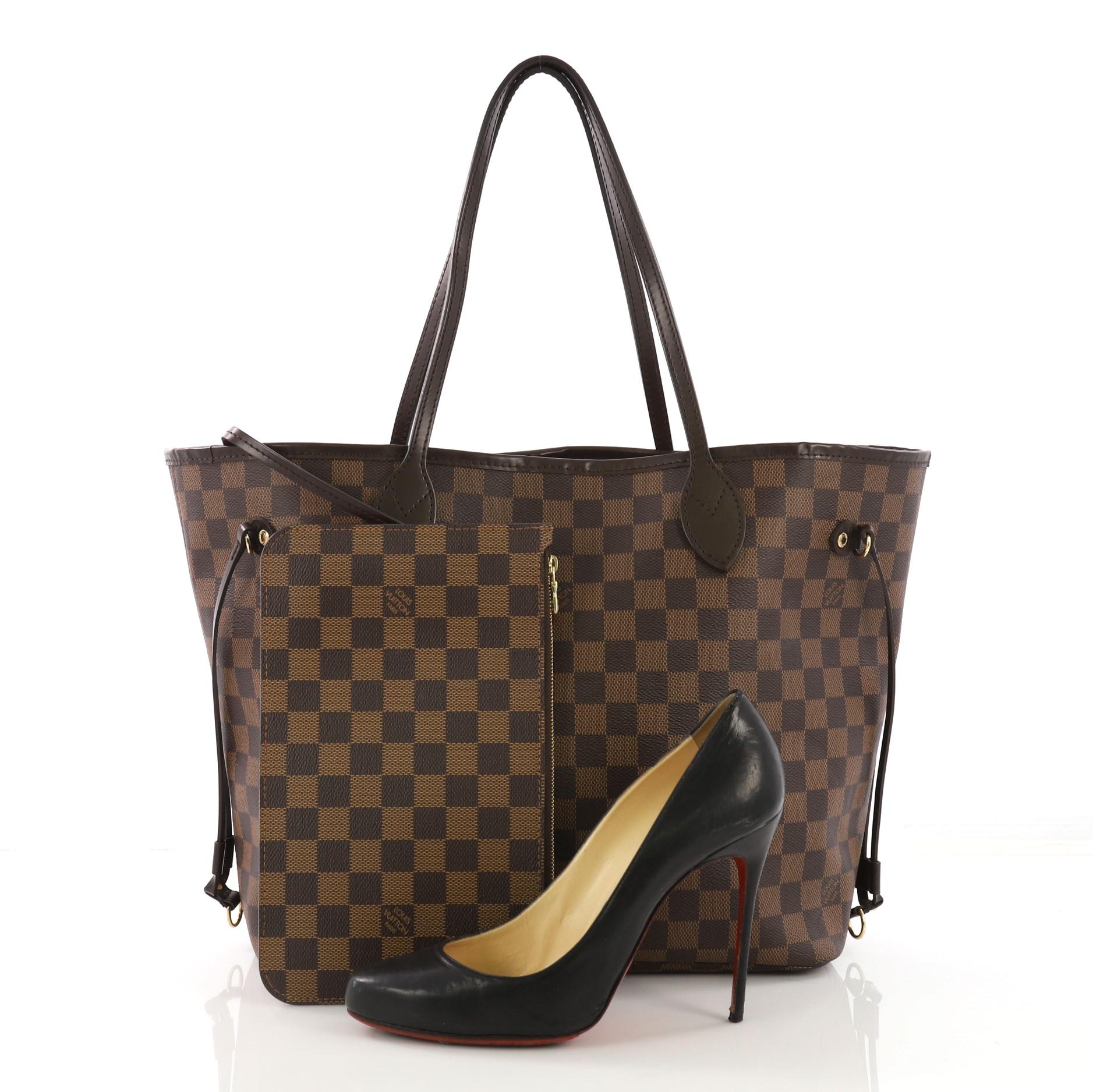 This Louis Vuitton Neverfull NM Tote Damier MM, crafted in damier ebene coated canvas, features dual slim handles, side laces, and gold-tone hardware. Its wide open top showcases a red fabric interior with side zip pocket. Authenticity code reads: