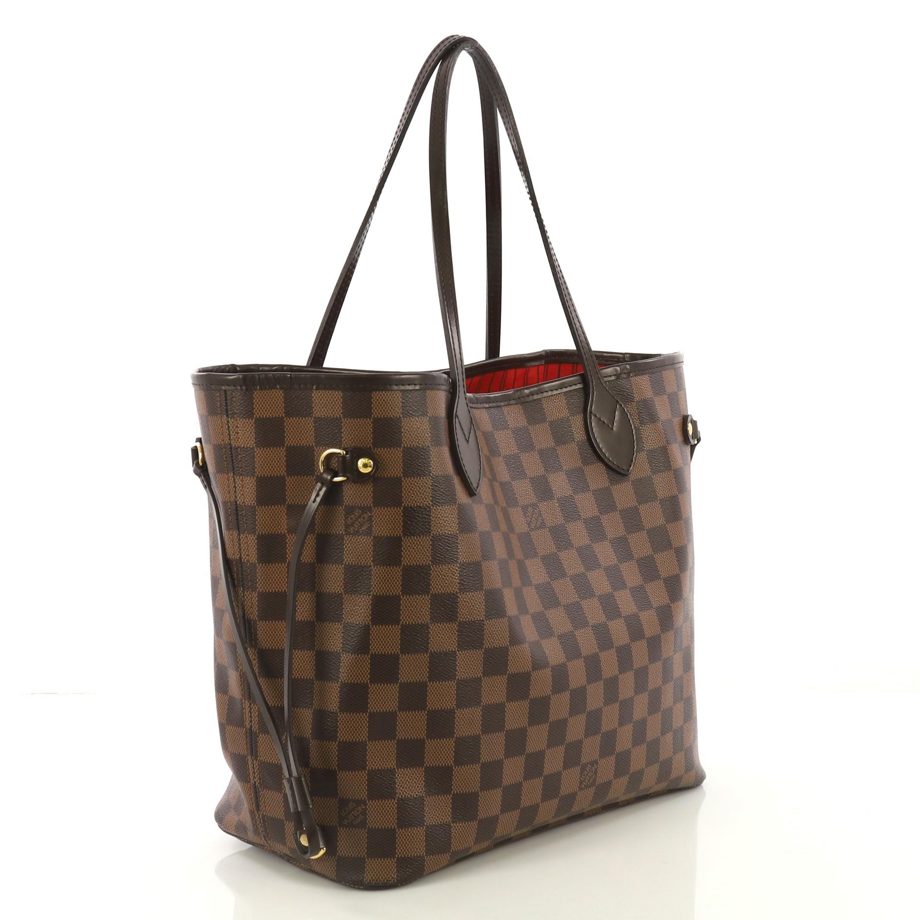 This Louis Vuitton Neverfull NM Tote Damier MM, crafted in damier ebene coated canvas, features dual slim handles, side laces, and gold-tone hardware. Its wide open top showcases a red fabric interior with side zip pocket. Authenticity code reads: