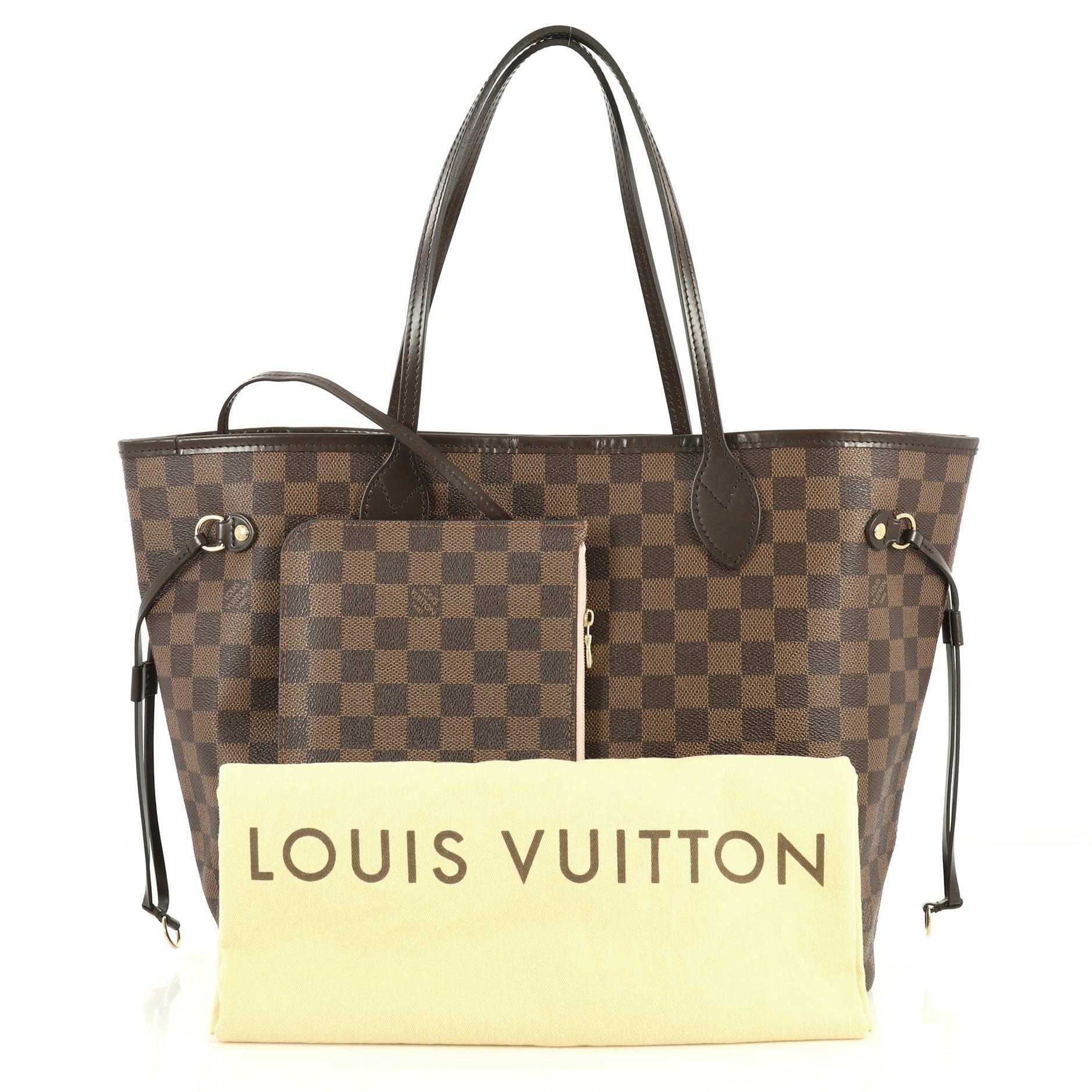This Louis Vuitton Neverfull NM Tote Damier MM, crafted in damier ebene coated canvas, features dual slim leather handles, side laces and gold-tone hardware. Its wide open top showcases a pink fabric interior with side zip pocket. Authenticity code