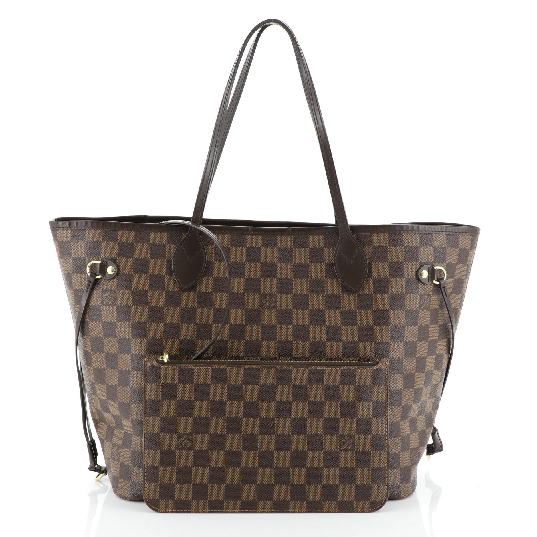 This Louis Vuitton Neverfull NM Tote Damier MM, crafted in damier ebene coated canvas, features dual slim leather handles, side laces and gold-tone hardware. Its wide open top showcases a red fabric interior with side zip pocket. Authenticity code