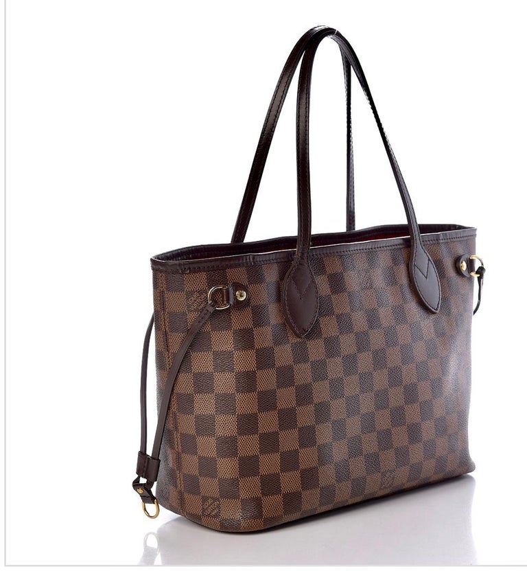 Louis Vuitton Neverfull PM Tote Bag - Damier Ebene   Canvas Tote
This authentic Louis Vuitton Neverfull PM Bag is an everyday tote with smaller proportions. This beautifully crafted blend of function and fashion is perfectly sized for holding just