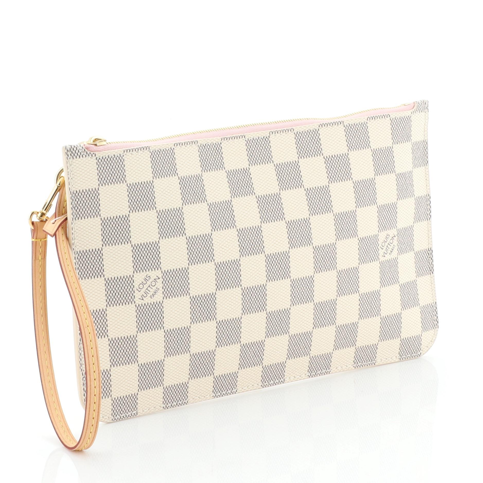 This Louis Vuitton Neverfull Pochette Damier Large, crafted from damier azur coated canvas, features leather wrist strap and gold-tone hardware. Its zip closure opens to a pink fabric interior with slip pocket. Authenticity code reads: MS1178.