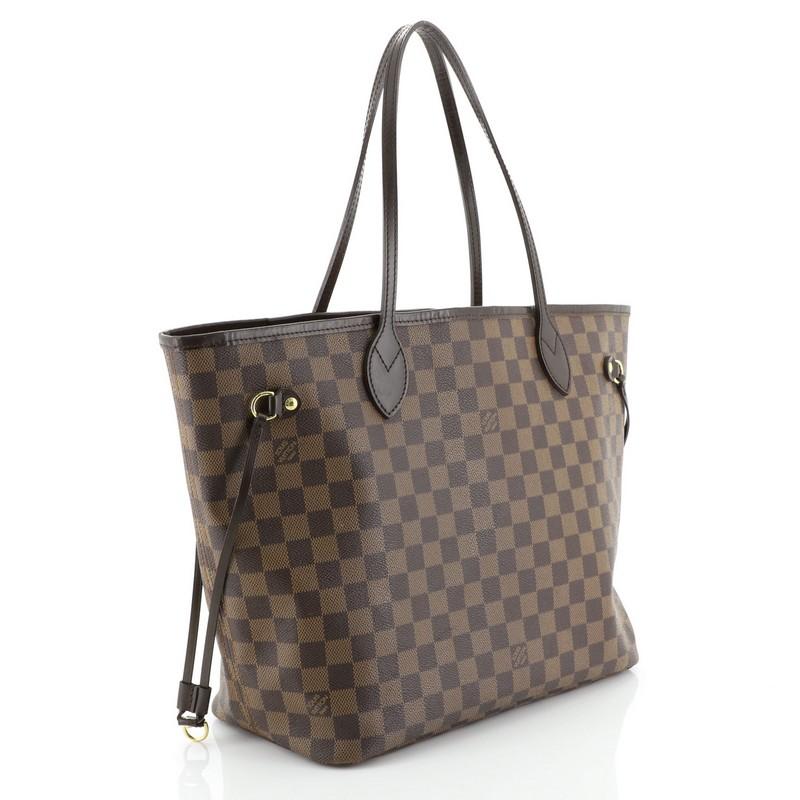 This Louis Vuitton Neverfull Tote Damier MM, crafted in damier ebene coated canvas, features dual slim handles, side laces, and gold-tone hardware. Its wide open top showcases a red fabric interior with side zip pocket. Authenticity code reads: