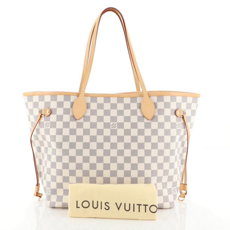 This Louis Vuitton Neverfull Tote Damier MM, crafted in damier azur coated canvas, features dual slim handles, side laces, and gold-tone hardware. Its wide open top showcases a neutral fabric interior with side zip pocket. Authenticity code reads: