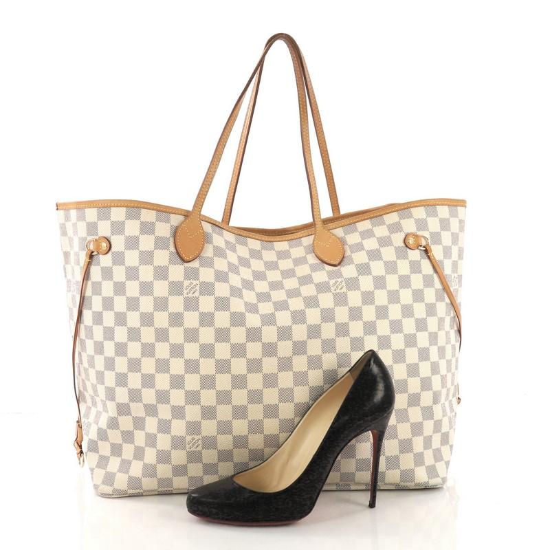 This Louis Vuitton Neverfull Tote Damier PM, crafted in damier azur coated canvas, features dual slim handles, side laces, and gold-tone hardware. Its wide open top showcases a beige fabric interior with side zip pocket. Authenticity code reads:
