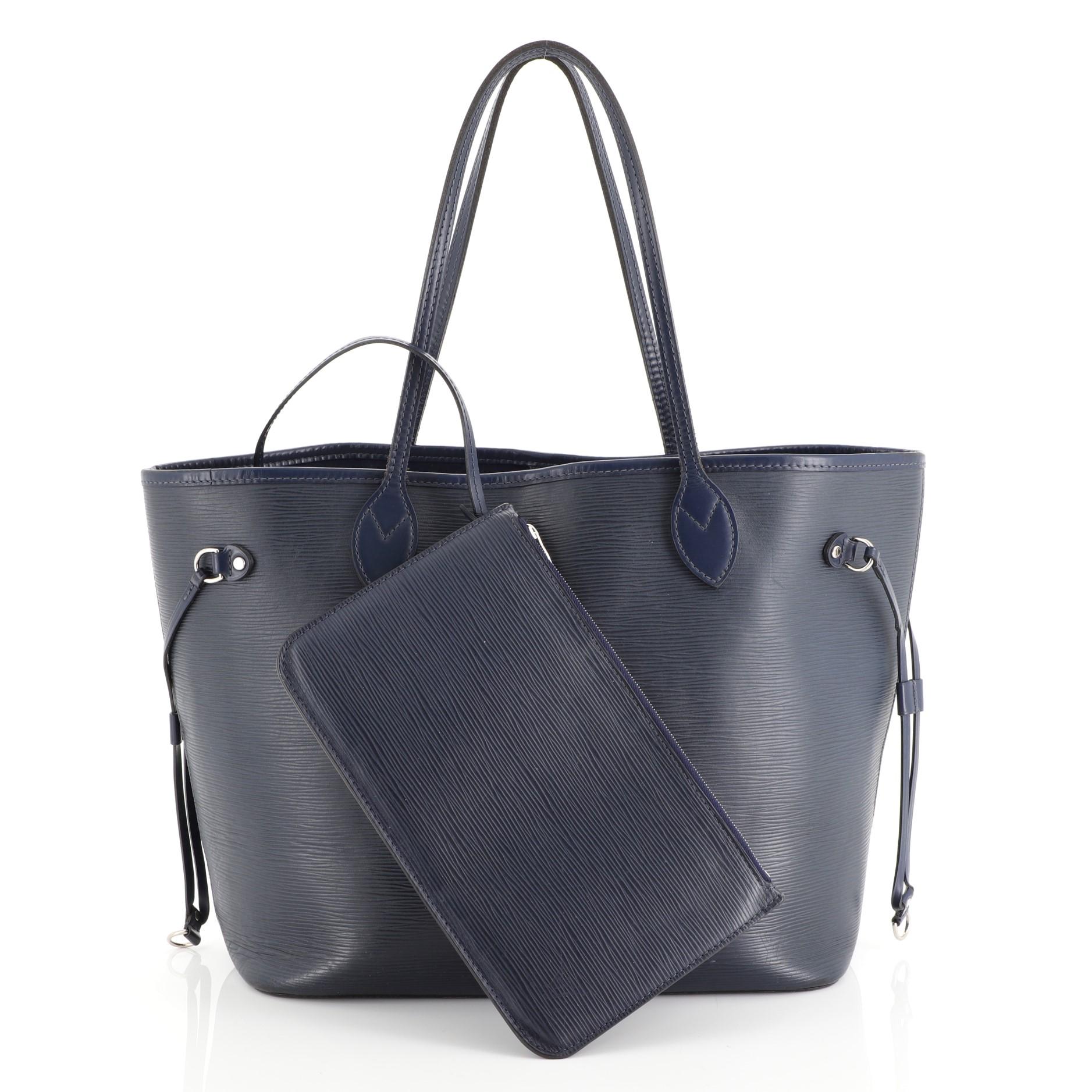 This Louis Vuitton Neverfull Tote Epi Leather MM, crafted in blue epi leather, features dual flat leather handles, side laces, and silver-tone hardware. Its hook closure opens to a blue microfiber interior. Authenticity code reads: SA1176.