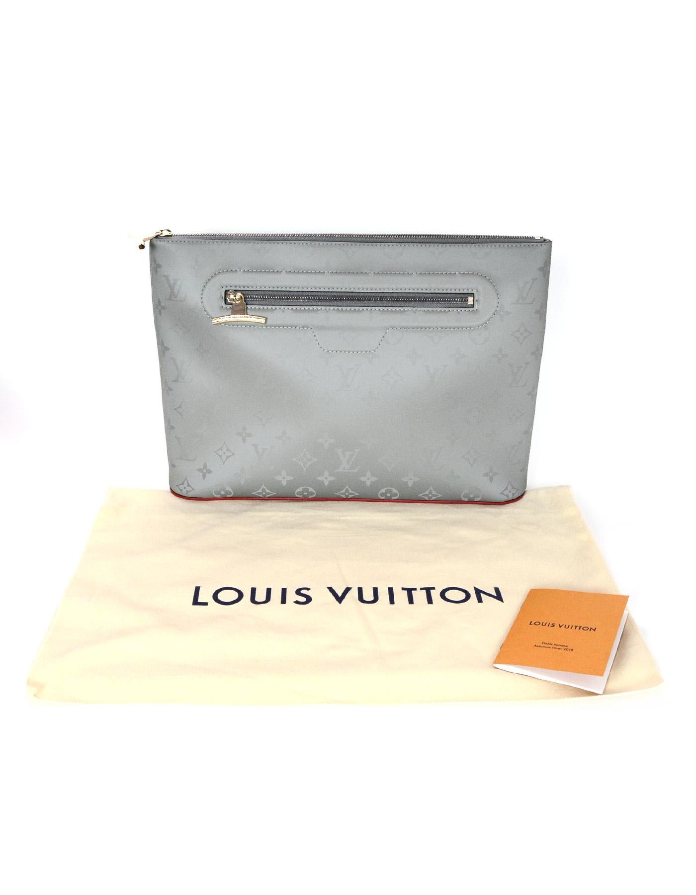 Louis Vuitton LV, 2018, New Monogram Grey Titanium Pochette Cosmos Bag

Made In: Italy
Year of Production: 2018
Color: Grey
Hardware: Silvertone
Materials: Titanium, canvas, and leather
Lining: Grey textile
Closure/Opening: Zipper top
Exterior