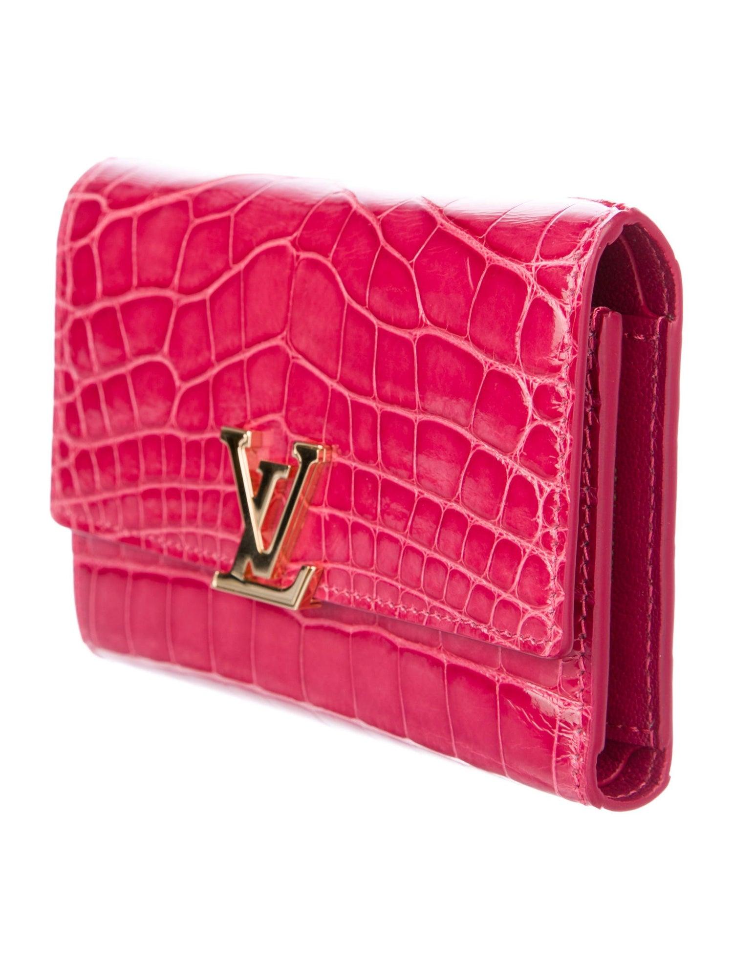 Louis Vuitton NEW Pink Alligator Exotic Gold Charm Small Clutch Wallet in Box

Alligator 
Brass hardware
Leather lining,
Features eight card slots
Snap closure
Date code present
Made in France
Measures 5.25