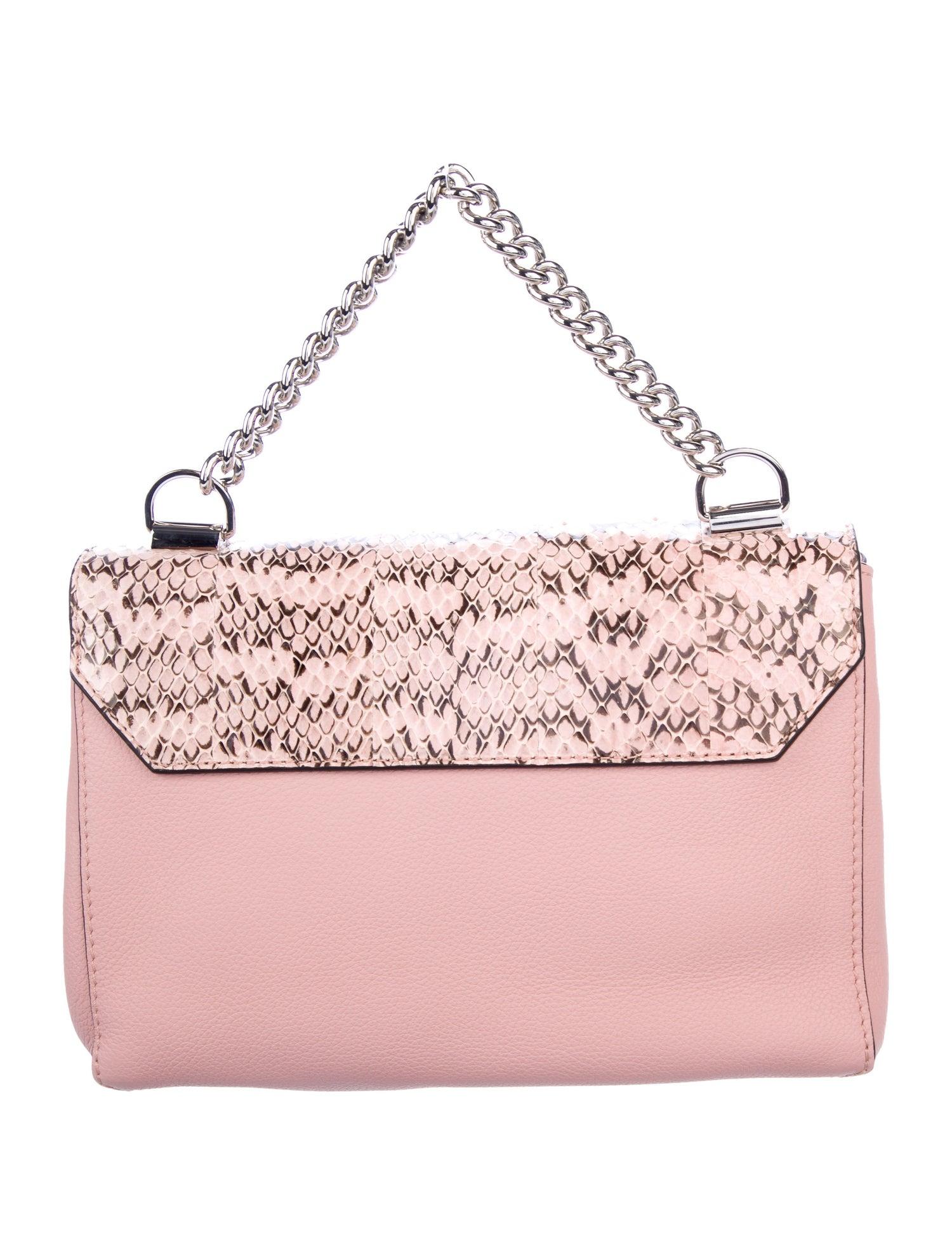 Snakeskin
Leather 
Silver-tone hardware
Woven lining 
Turn-lock closure 
Made in France
Handle drop 3