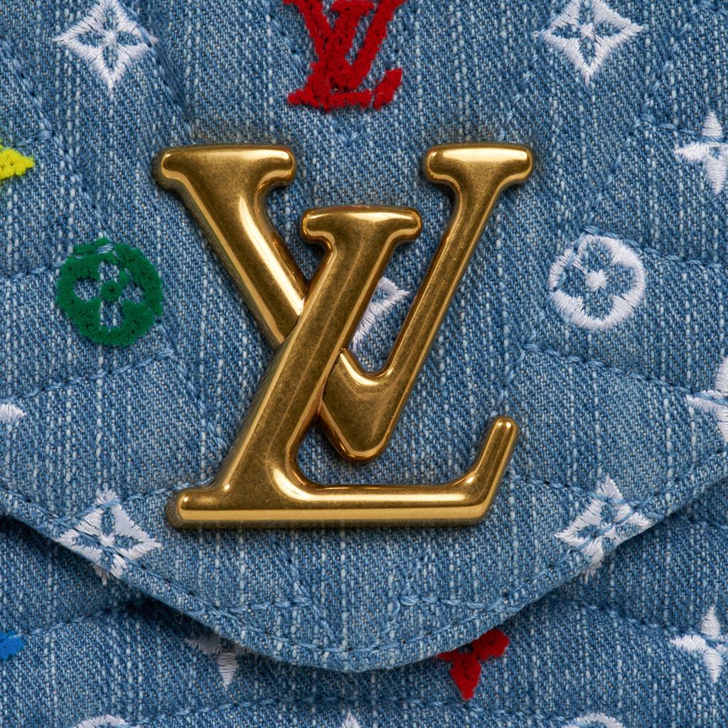 Guaranteed authentic Louis Vuitton New Wave Chain Bag MM.  
Introduced in Spring-Summer 2019 season.
The bag comes in blue quilted LV denim with multicolored embroidered and tufted flowers and LV's. 
A versatile bag - can be carried as a top handle