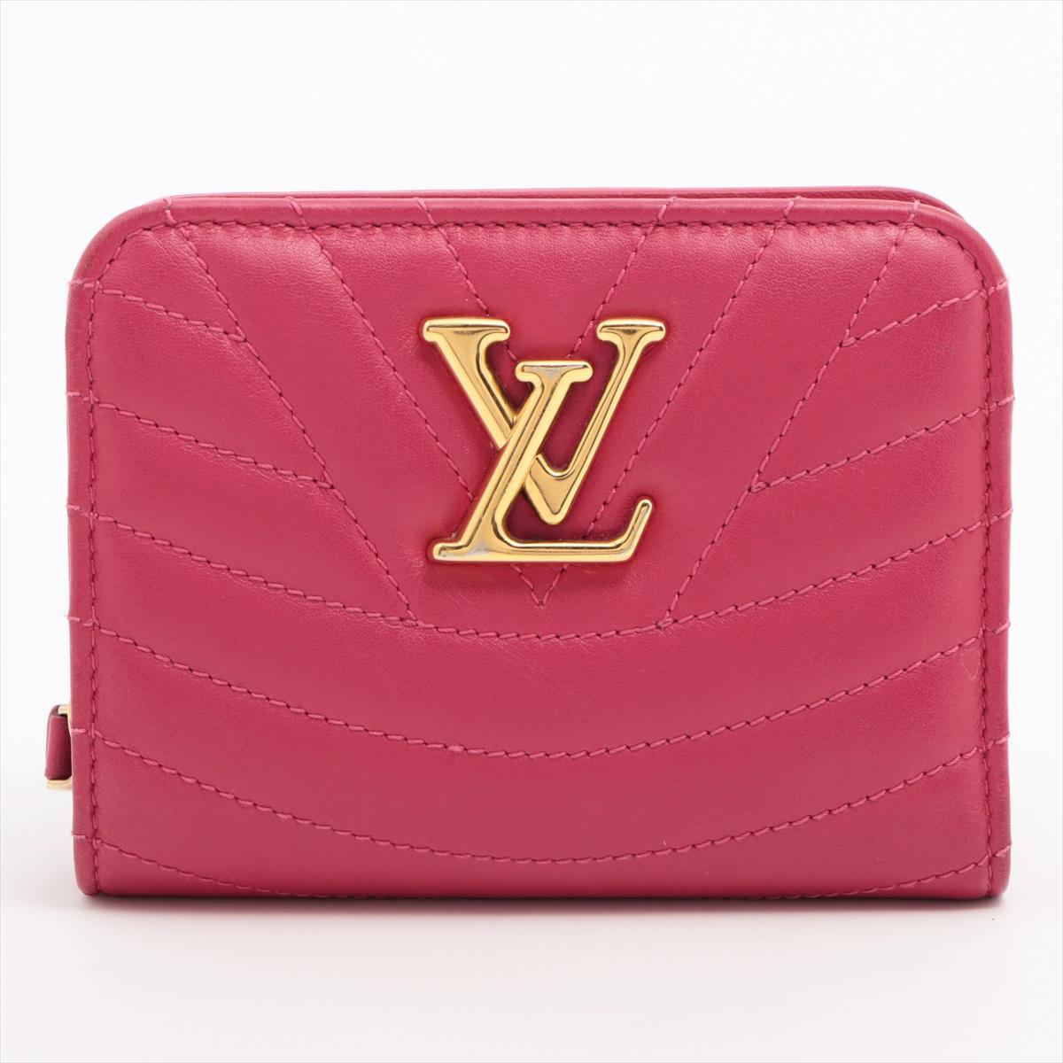 The Louis Vuitton New Wave Zipped Compact Wallet in Fuchsia is a stylish and compact accessory that adds a pop of color to any ensemble. Crafted from premium leather, the wallet showcases the brand's iconic New Wave design, featuring a wave-like
