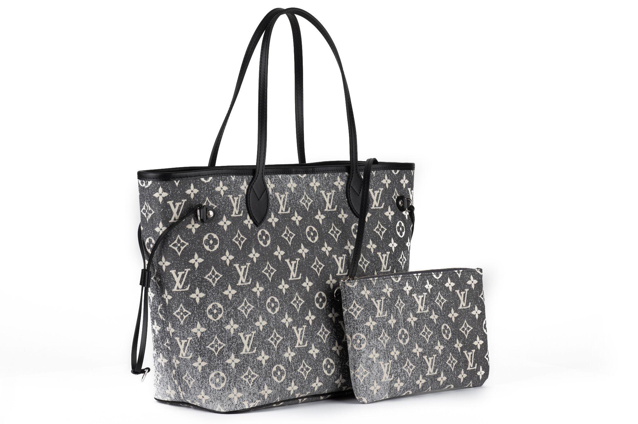 Louis Vuitton new neverfull MM with detachable pouch. Grey denim monogram canvas and black cowhide trim. Shoulder drops 8”. Comes with original dustcover and box.