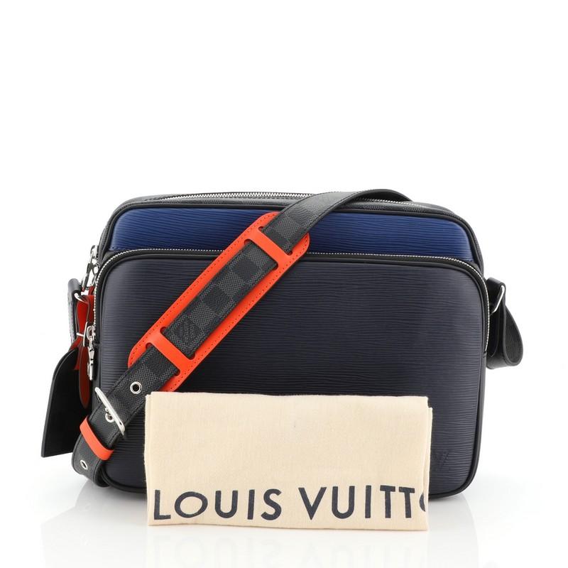 This Louis Vuitton Nil Slim Messenger Bag Epi Leather with Damier Graphite PM, crafted from blue epi leather with damier graphite coated canvas, features an adjustable strap, exterior front zip pocket and silver-tone hardware. Its top zip closure