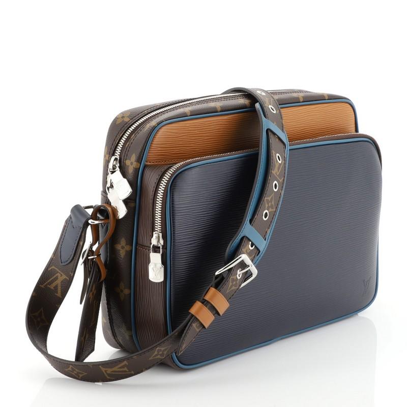 This Louis Vuitton Nil Slim Messenger Bag Epi Leather with Monogram Canvas PM, crafted from blue epi leather with brown monogram coated canvas, features an adjustable strap, exterior front zip pocket and silver-tone hardware. Its top zip closure