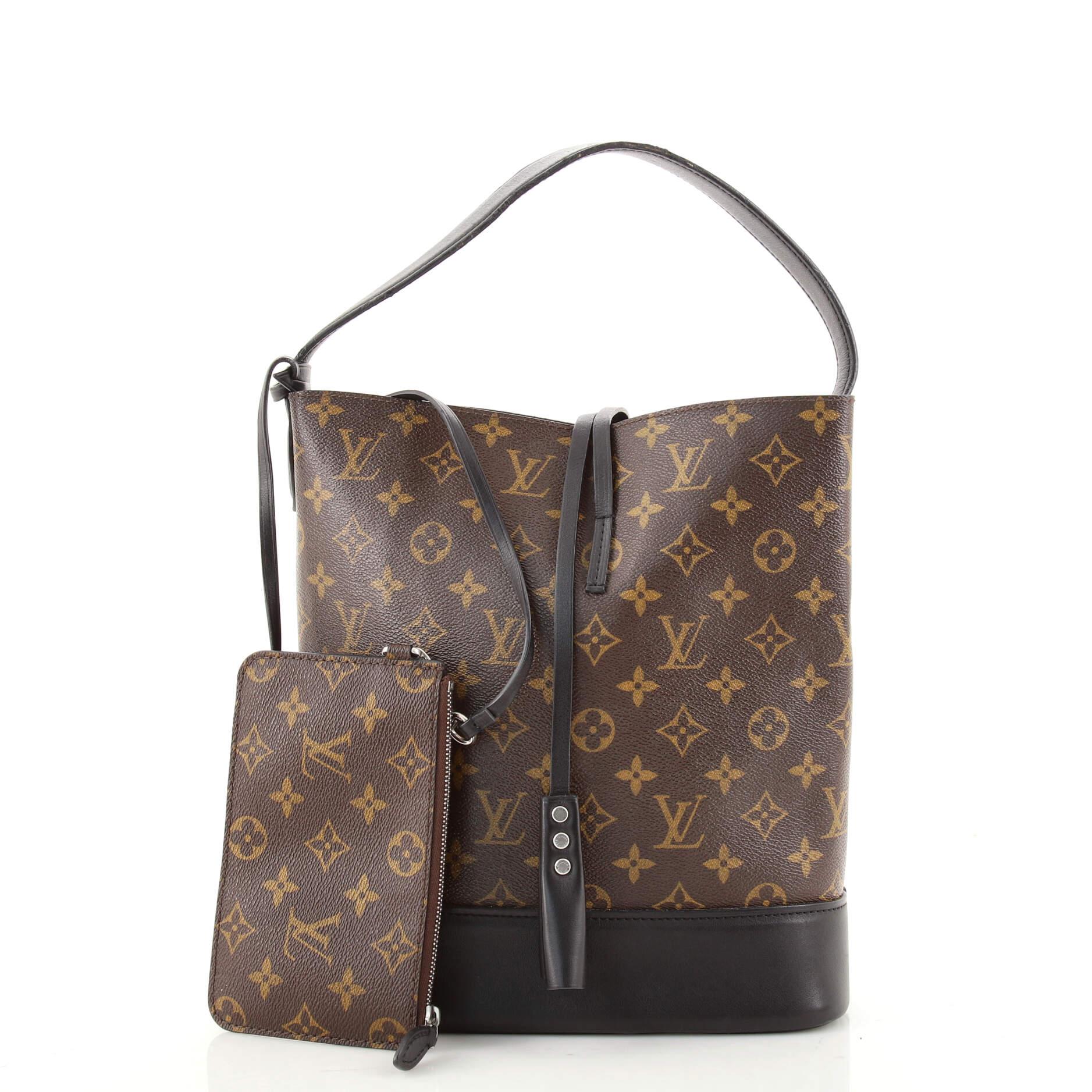 Condition: Fair. Odor in interior. Loss of shape on exterior, moderate wear and scuffs on leather trims, heavy wear on base corners. Moderate wear and indentations on handle, heavy melting and indentations on handle wax edges. Wear in interior,