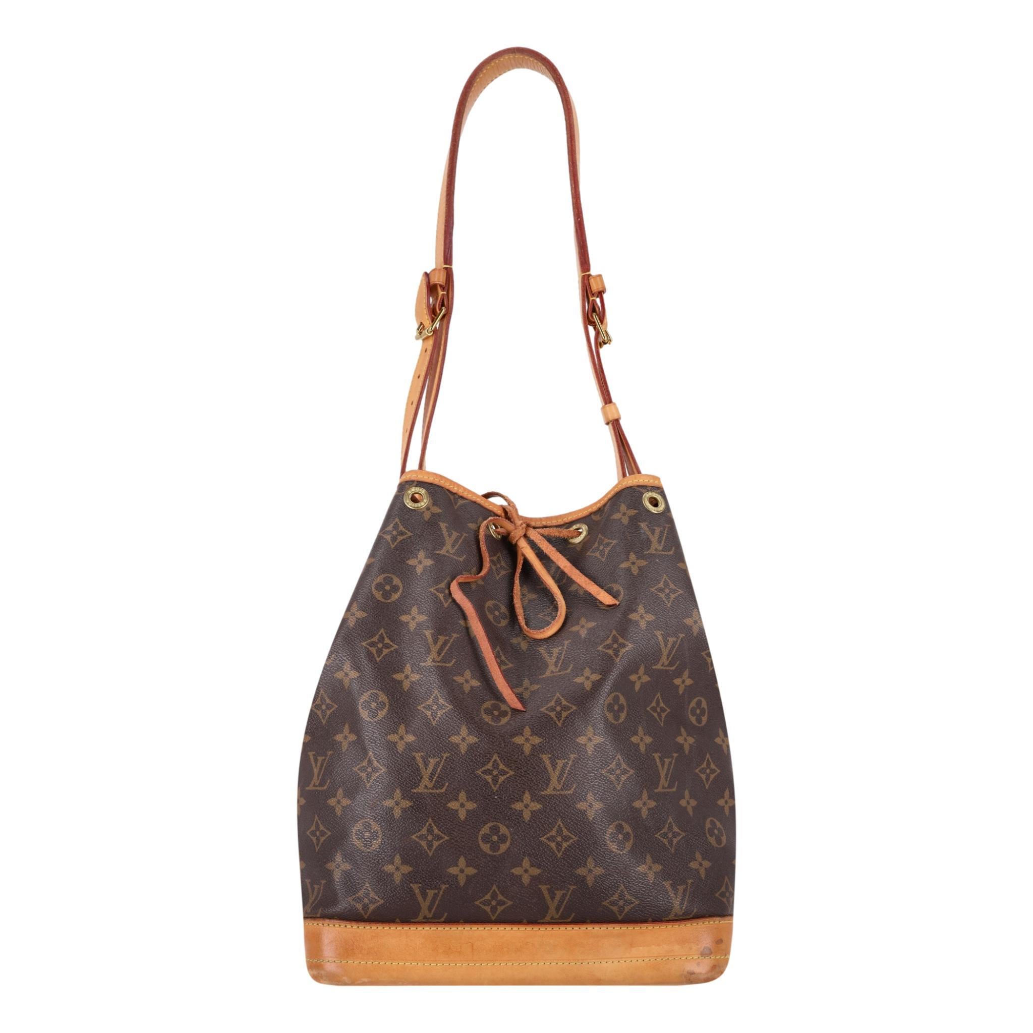 Louis Vuitton Noe Monogram Coated Canvas Bucket Bag

Brown bucket bag crafted from LV's signature monogram coated canvas.

Featuring light brown leather base and adjustable shoulder strap.

Cinched top with a drawstring closure leading to spacious