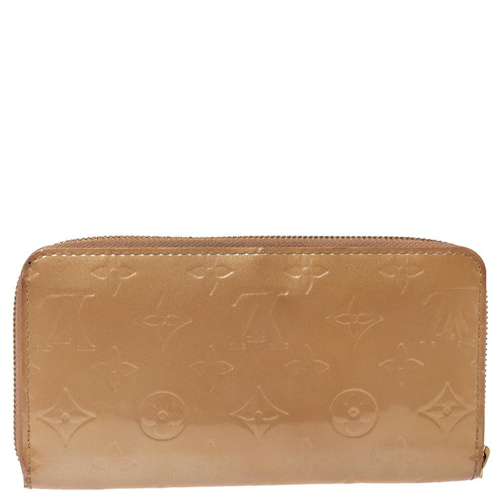 This Louis Vuitton Zippy wallet is conveniently designed for everyday use. Crafted from Monogram Vernis leather, the wallet has a wide zip closure which opens to reveal multiple slots, leather-lined compartments and a zip pocket for you to neatly