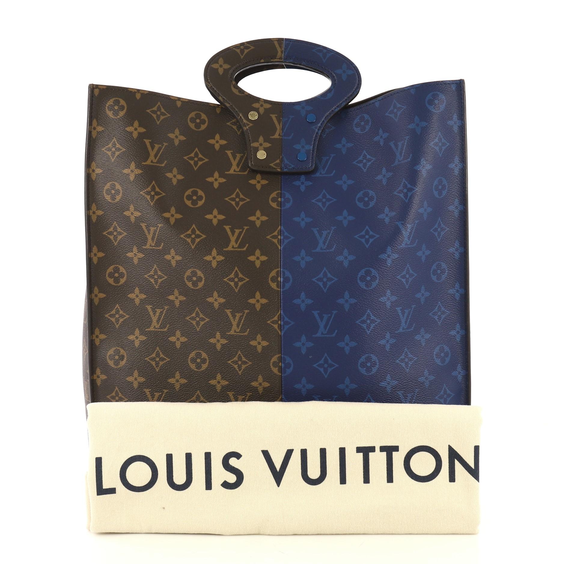This Louis Vuitton North South Tote Monogram Eclipse Split Canvas, crafted from brown and blue monogram eclipse split coated canvas, features dual top handles and gold-tone hardware. It opens to a brown microfiber interior with zip compartment.