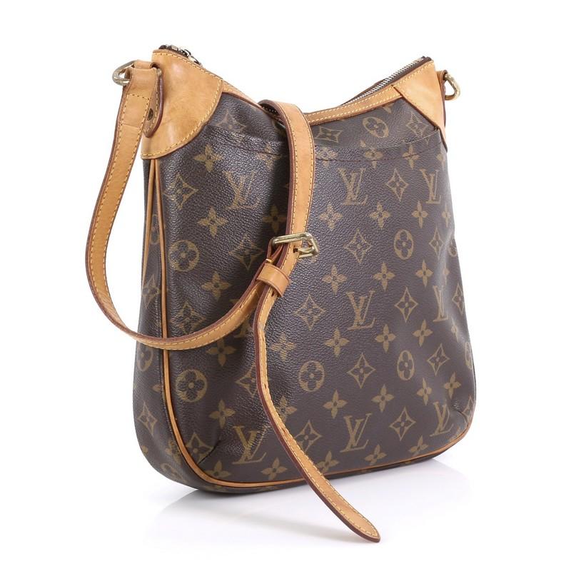 This Louis Vuitton Odeon Handbag Monogram Canvas PM, crafted from brown monogram coated canvas, features an exterior flat pocket, adjustable flat vachetta leather strap, and gold-tone hardware. Its zip closure opens to a brown fabric interior with