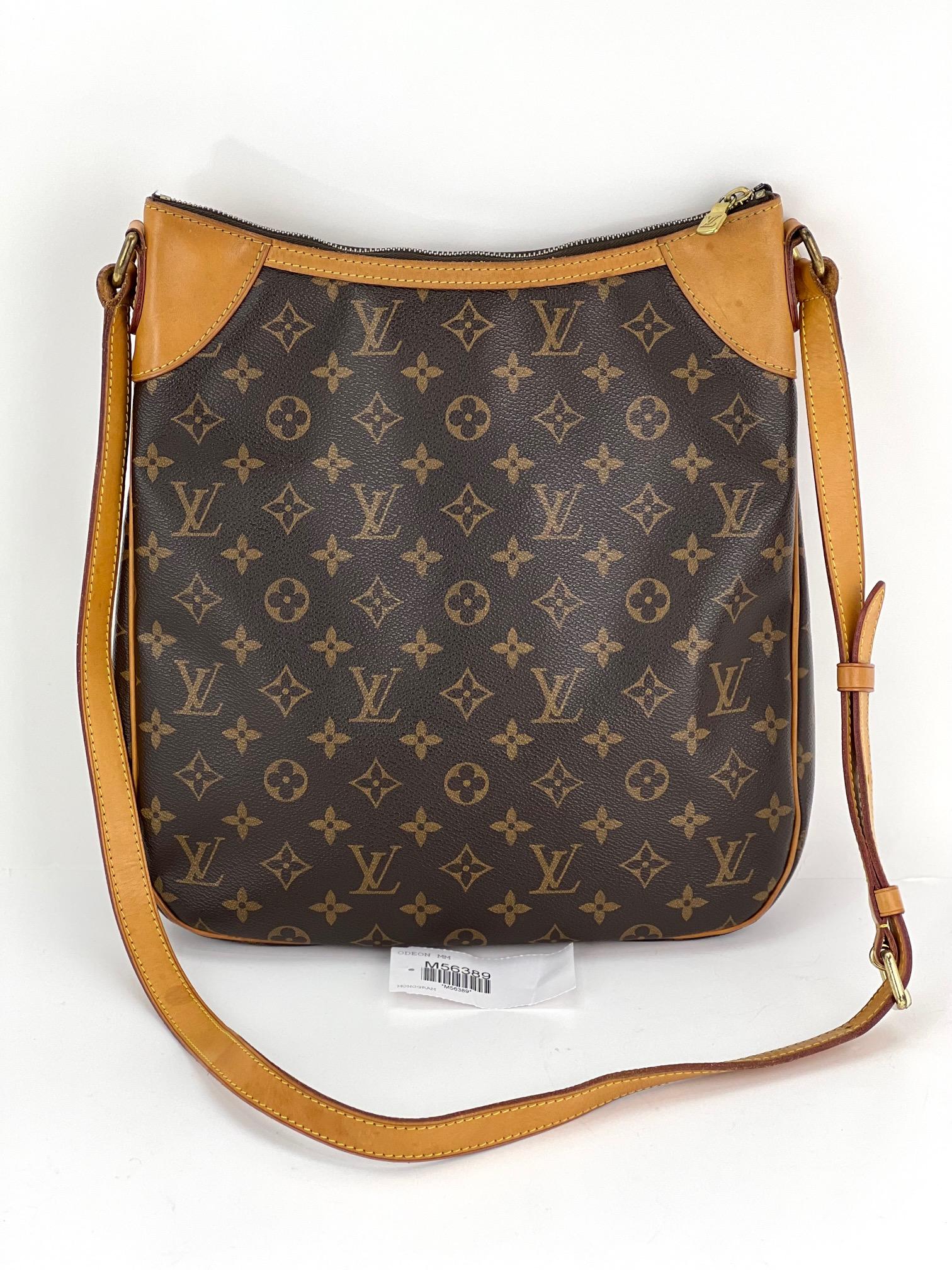Pre-Owned  100% Authentic
LOUIS VUITTON Odeon MM Monogram M56389
RATING: B...Good, well maintained,
shows minor signs of wear
MATERIAL: monogram canvas, leather trims
LEATHER TRIM: leather on top corners and piping
have some light marks and