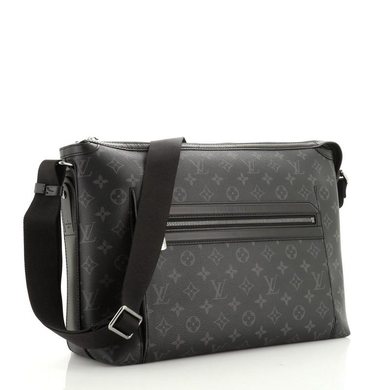 This Louis Vuitton Odyssey Messenger Bag Monogram Eclipse Canvas MM, crafted from monogram eclipse coated canvas, features adjustable strap, exterior zip pocket and gunmetal-tone hardware. Its zip closure opens to a black fabric interior with slip