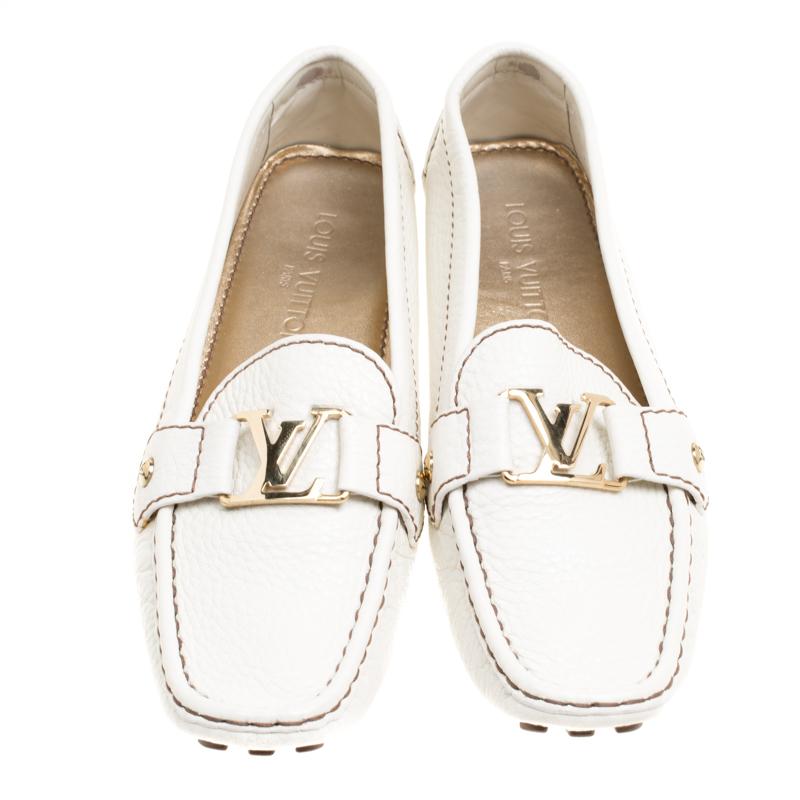 Louis Vuitton loafers are loved by men and women worldwide and are perfect for making a fashion statement. These off-white loafers are crafted from leather and feature a chic design. They flaunt squared toes, a gold-tone LV buckle detailing,