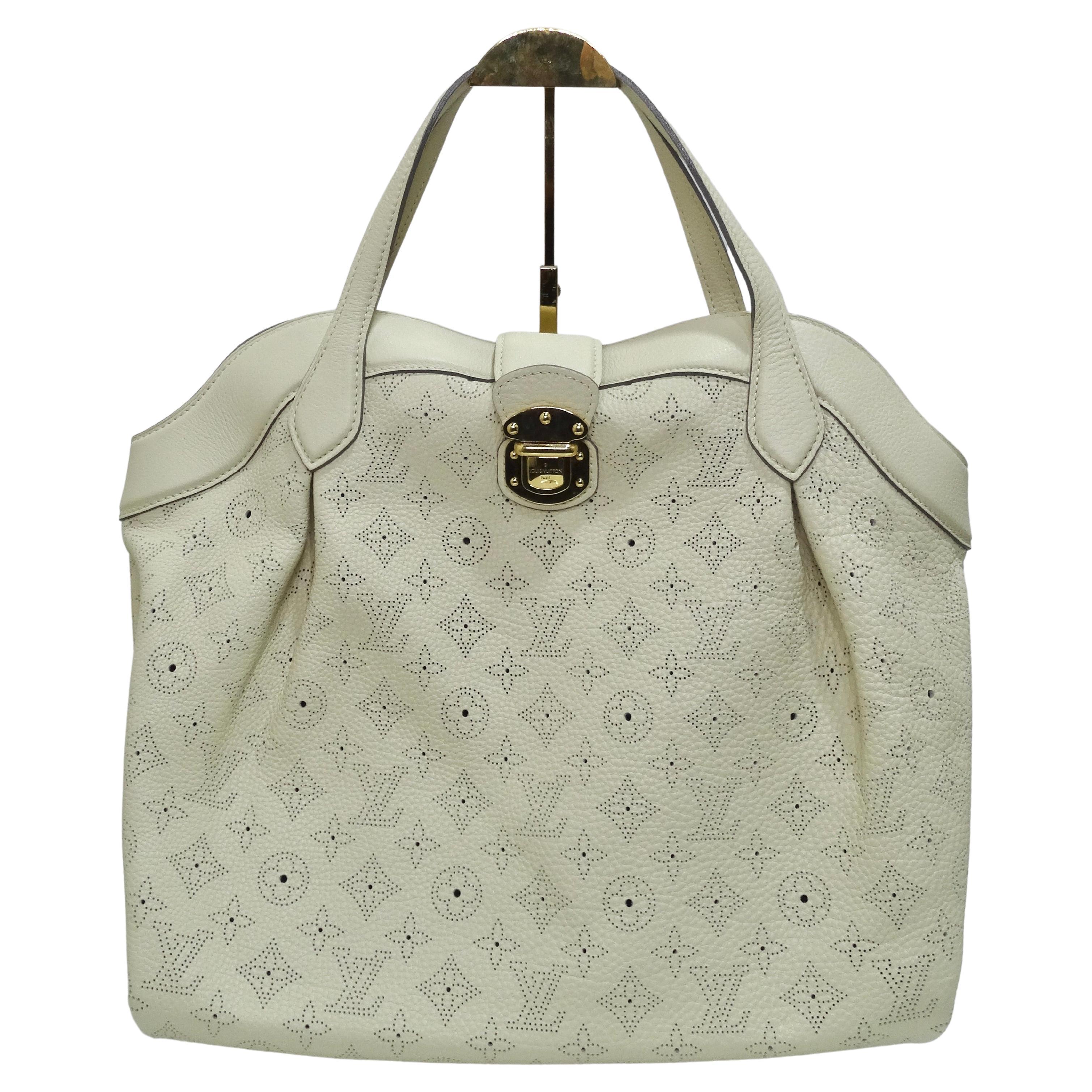 NOW TRENDING: Slouchy oversized bags! 
Ensure your daily essentials are in order and your outfit is complete with this designer Louis Vuitton bag. This Louis Vuitton PM Cirrus Mahina Handbag is crafted of the best materials in a perforated Monogram