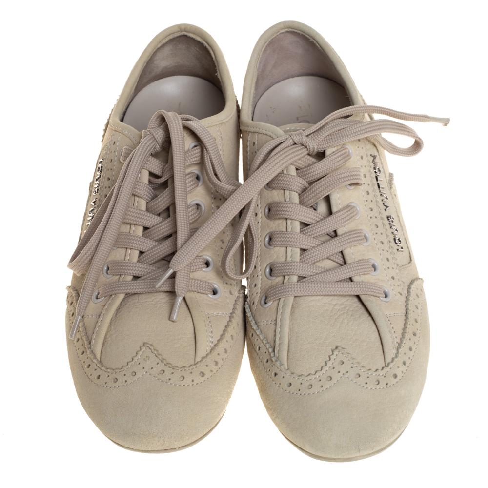 Femininity meets functionality in these sneakers from Louis Vuitton. Crafted from nubuck leather, this stunning pair comes in a lovely shade. The exterior is defined with lace-ups, intricate brogue detailing, logo detailing, and neat stitching. The