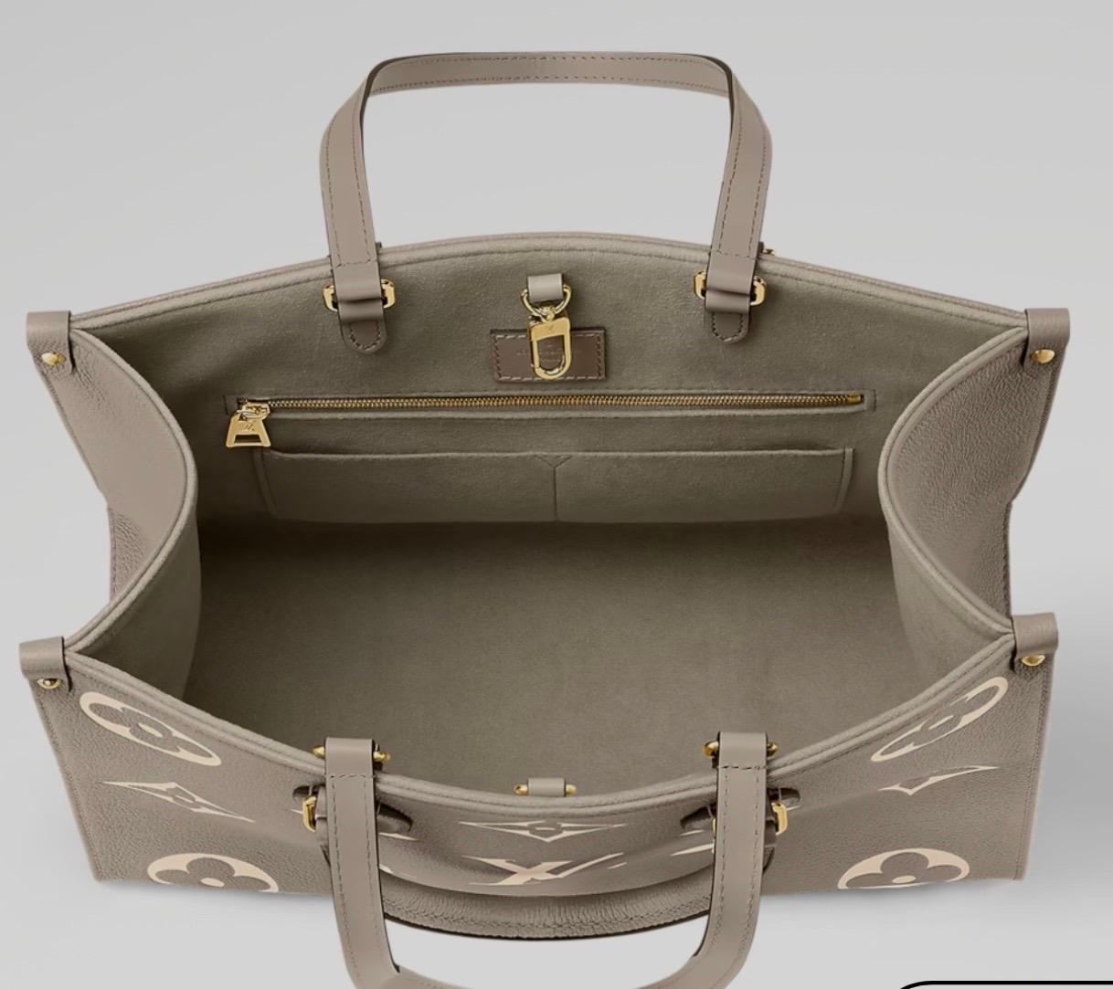 Louis Vuitton On The Go BICOLOR MM Monogram Empreinte Leather, Colombe/Crème Pour femmes en vente