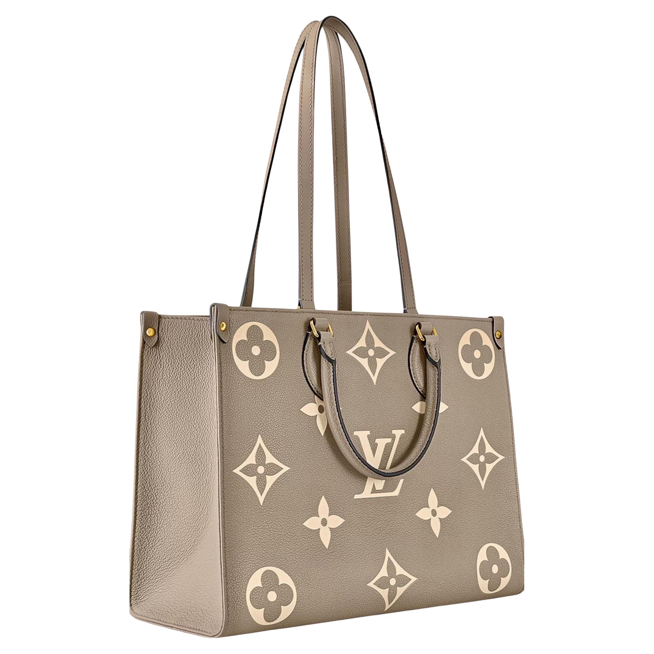 Louis Vuitton On The Go BICOLOR MM Monogram Empreinte Leather, Colombe/Crème en vente
