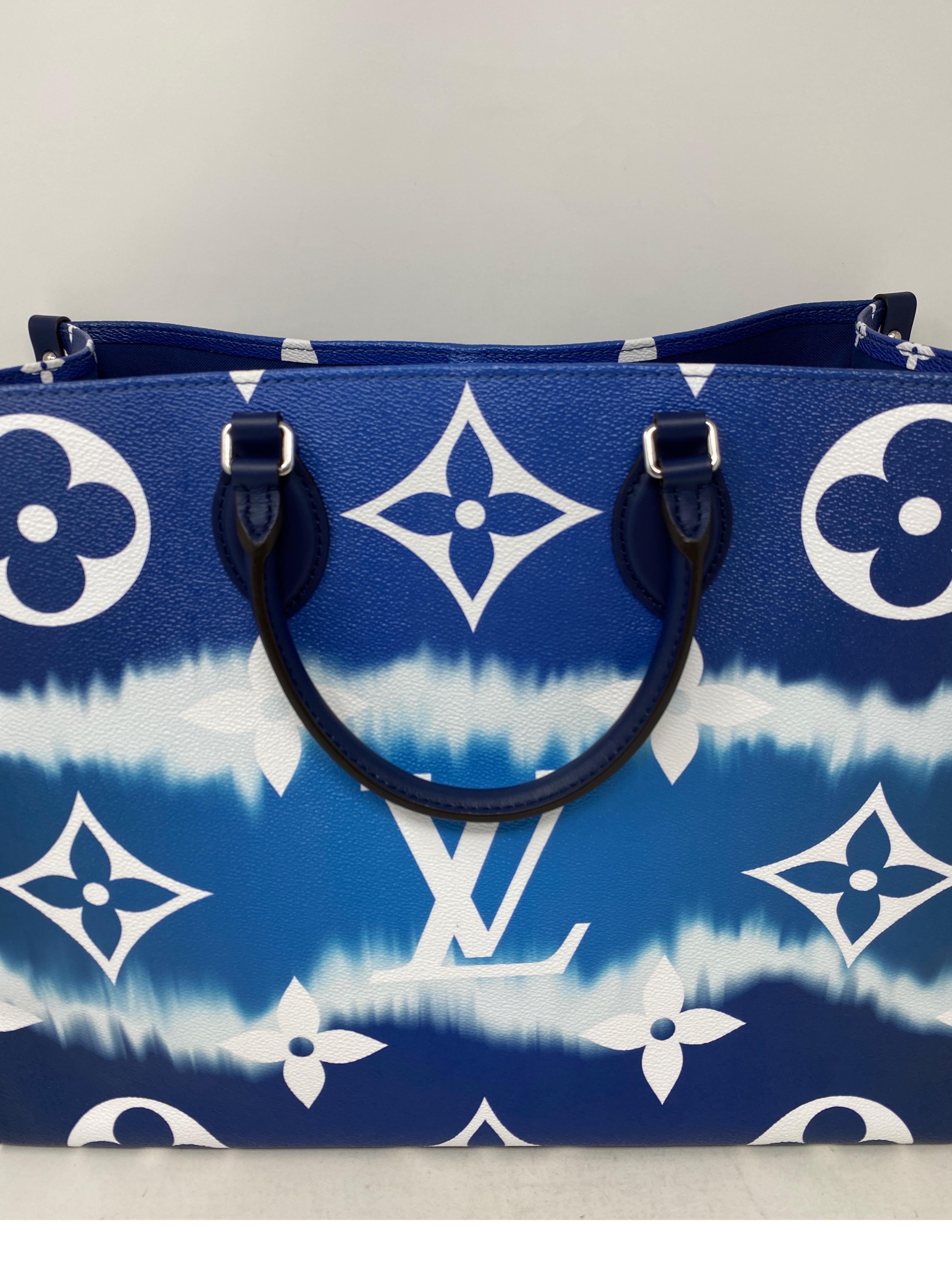 Louis Vuitton Blue On The Go Escale Tote Bag. Excellent condition. Limited and rare collector's piece. Can be worn 2 ways with 2 size handles. Guaranteed authentic. 