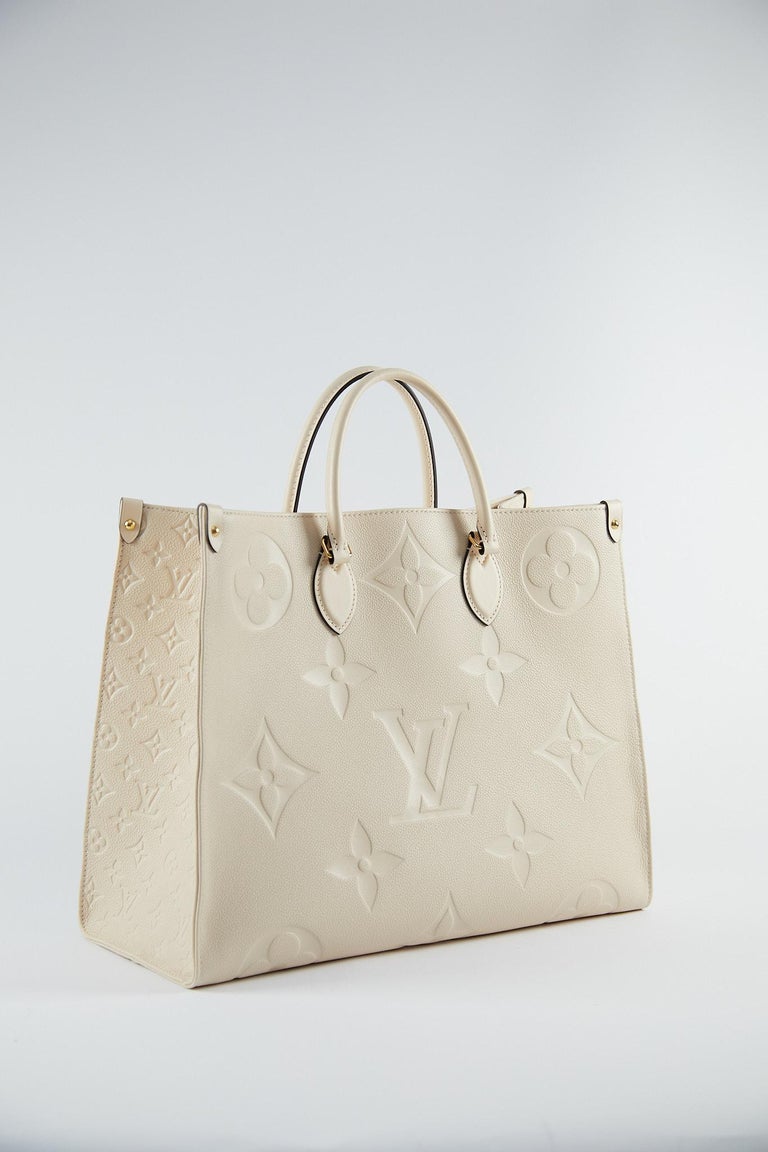 Louis Vuitton On the Go Tote in Off White

Tote in Monogram Empreinte Giant embossed, grained cowhide leather with a microfibre lining and gold-colour hardware 

Measurements: L 41 x 34 x 19 cm 