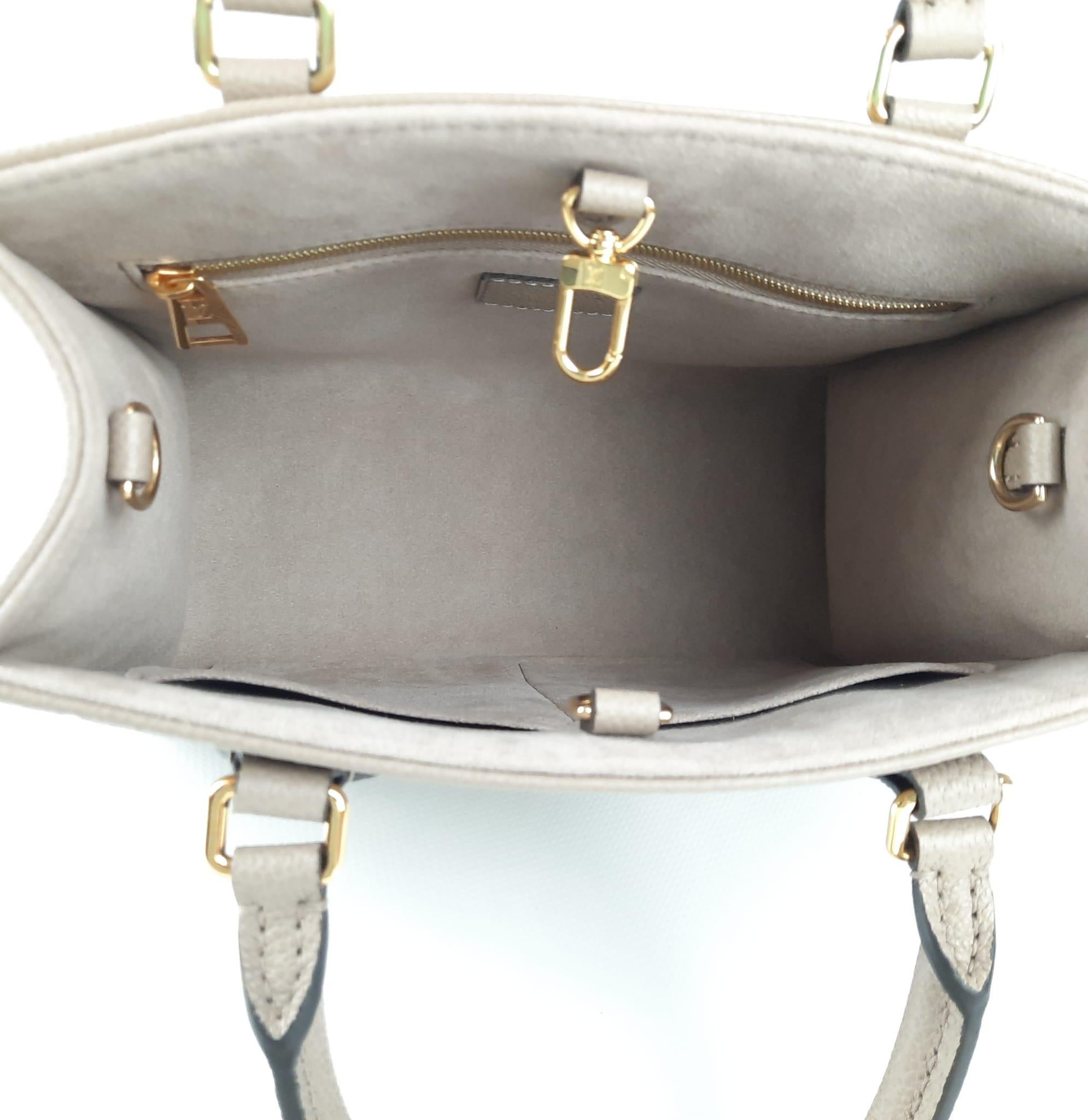 Louis Vuitton Onthego PM Tote Bag Tourterelle / Crème Monogram Empreinte Leather For Sale 1