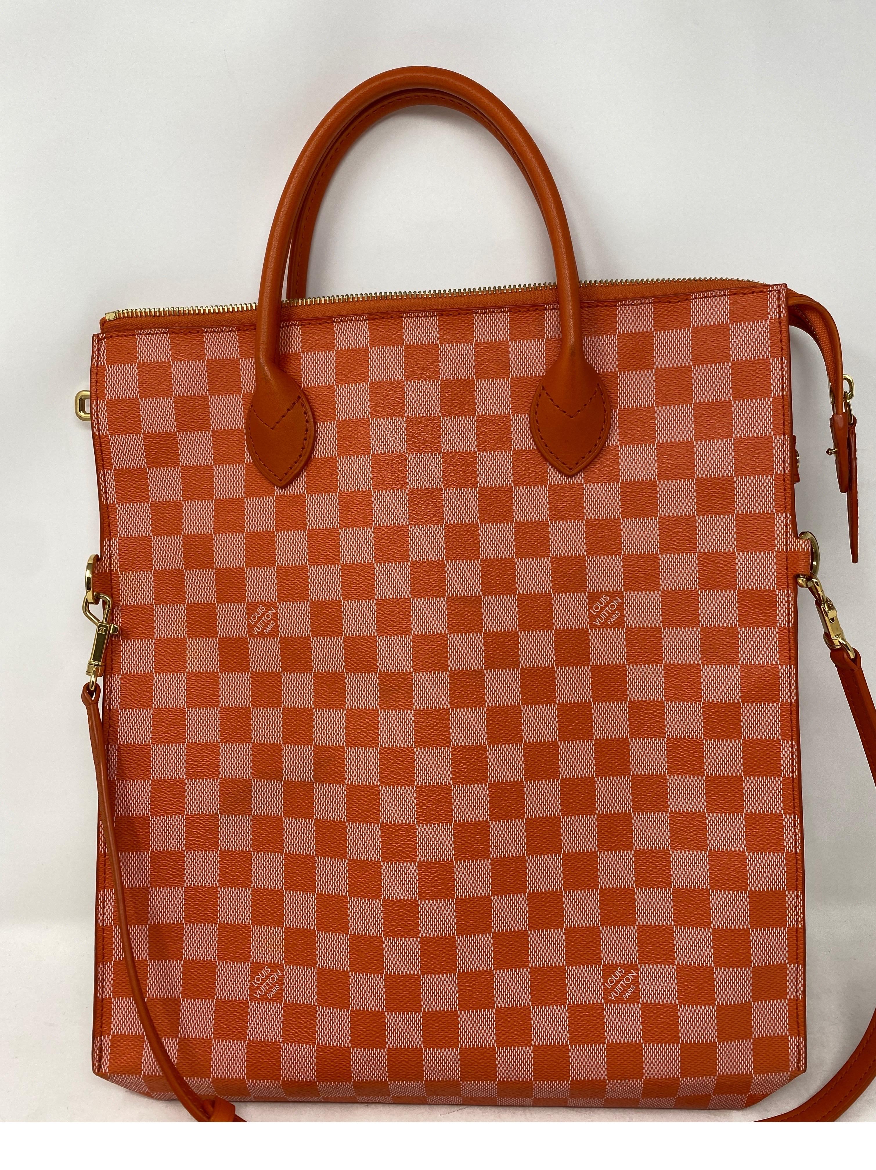 Louis Vuitton Orange Check Ebene Bag. Unique style bag from LV. Good condition. Light wear inside. Strap can be taken off. Wearable 2 ways. Guaranteed authentic. 