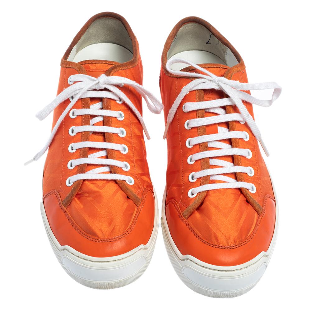 Made from a combination of fabric and leather, these Louis Vuitton sneakers are ideal for your casual ensembles. They come in an orange shade and are finished off with round toes and laces on the vamps.

