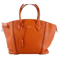 Louis Vuitton Orange Taurillon Leder Soft LockIt PM Handtasche