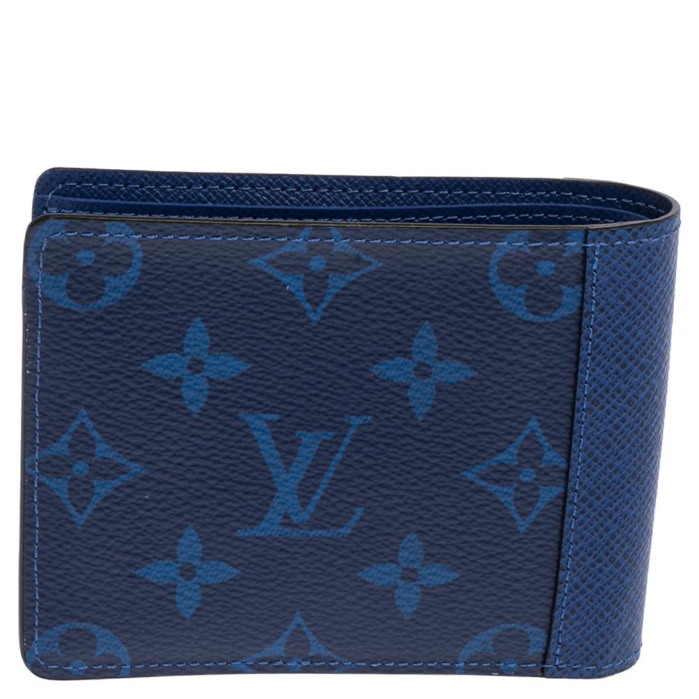The compact wallet by Louis Vuitton in monogram Pacific canvas and Taiga leather brings a luxurious appeal and high quality. The wallet is designed to easily hold your cards, bills, and receipts.

Includes: Original Box,Original Dustbag