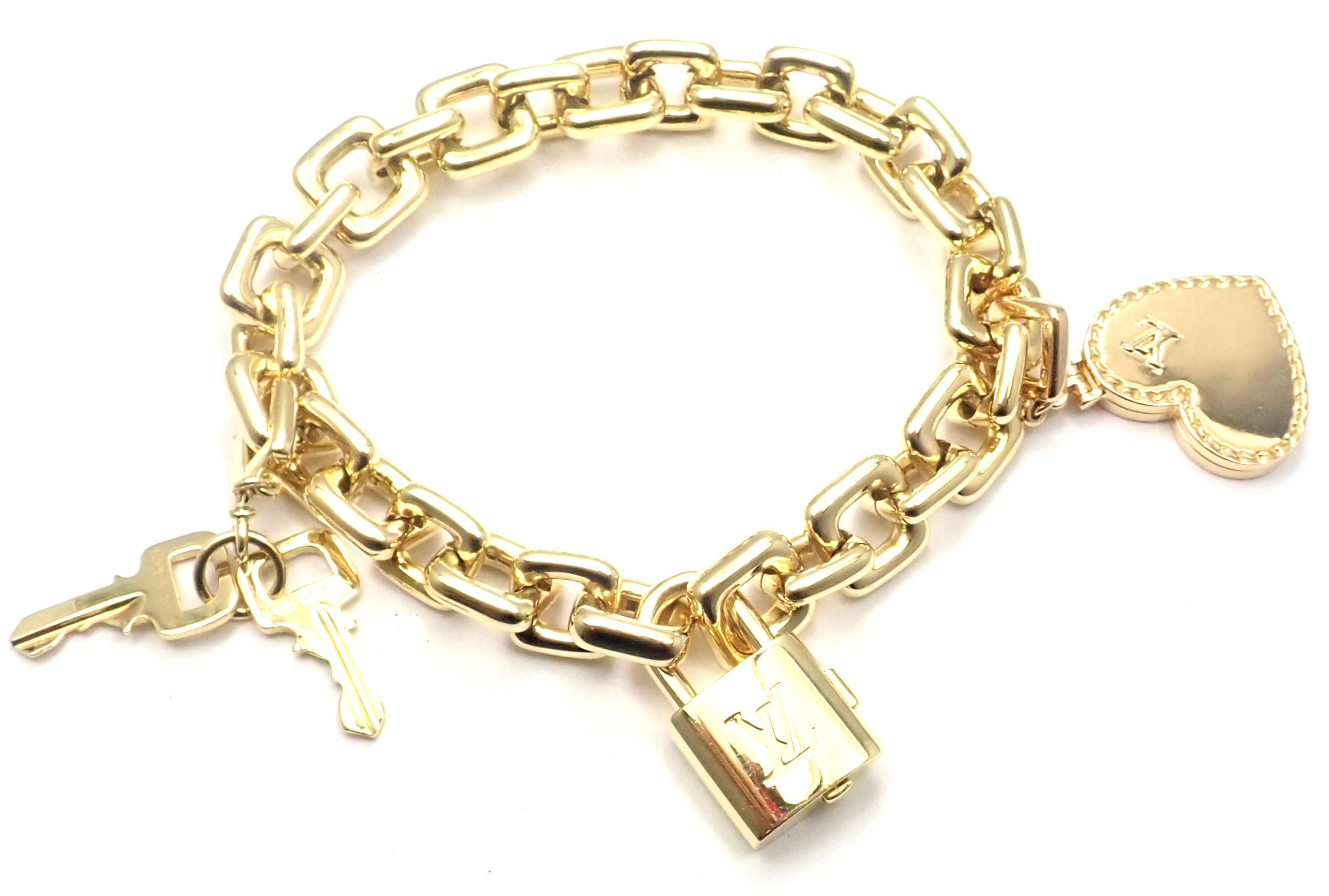 18k Yellow Gold Padlock Keys Charm And Heart Locket Charm Link Bracelet by Louis Vuitton. 
With Charms: Keys, Padlock, Heart Locket
Details: 
Length: 8