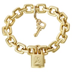 Pulsera candado y llave Louis Vuitton de oro amarillo de 18 quilates