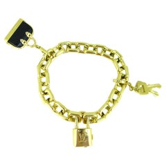 Louis Vuitton Vintage 18 Karat Gold Charm Bracelet with Original Case at  1stDibs
