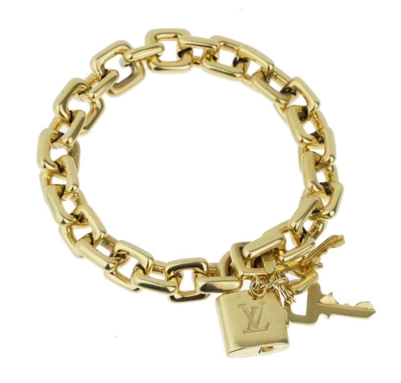 Louis Vuitton Padlock & Keys+ Two Bags Charm Bracelet en or jaune 125.7 Gm 18 KG Excellent état - En vente à New York, NY