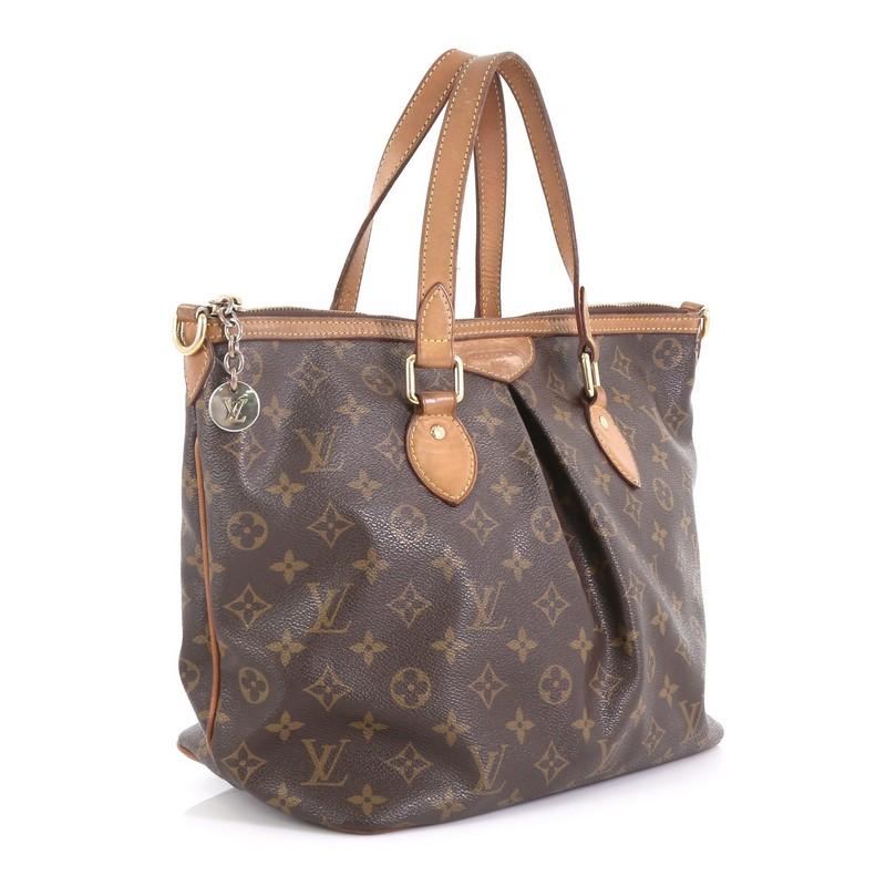 This Louis Vuitton Palermo Handbag Monogram Canvas PM, crafted from brown monogram coated canvas, features dual flat leather handles, vachetta leather trim, pleated silhouette, and gold-tone hardware. Its zip closure opens to a brown fabric interior
