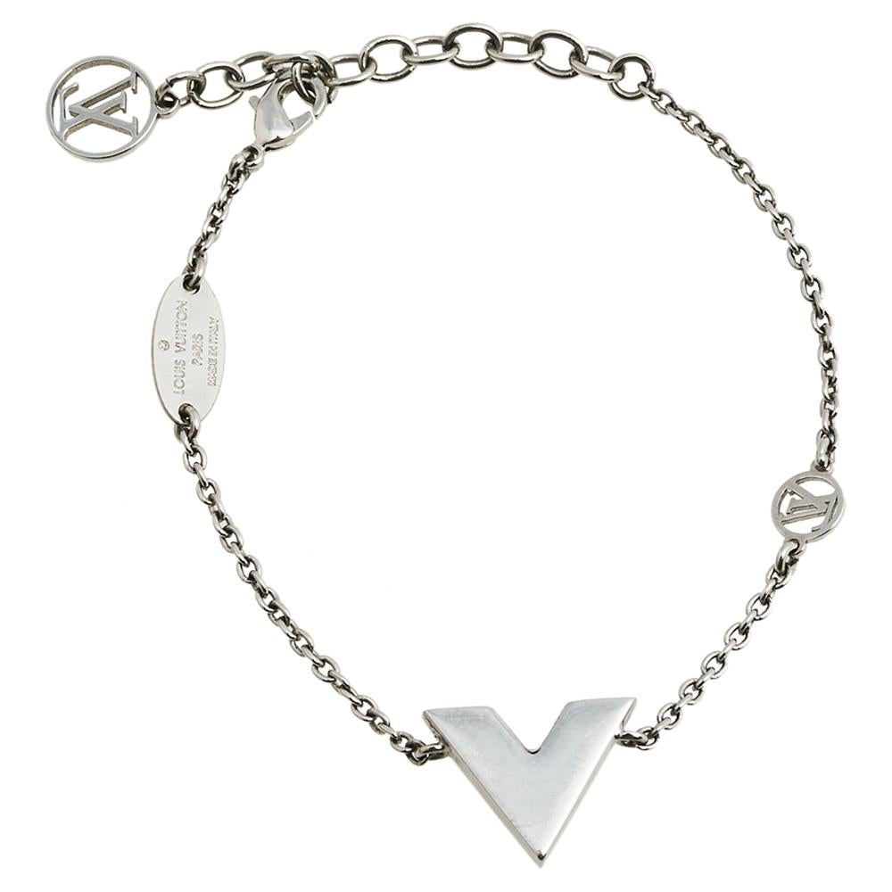 Create an elegant, timeless, and classic addition to both casual and even special events with this beautiful Louis Vuitton Essential V bracelet. Constructed in palladium-finish metal, this bracelet features a V charm and an adjustable lobster hook