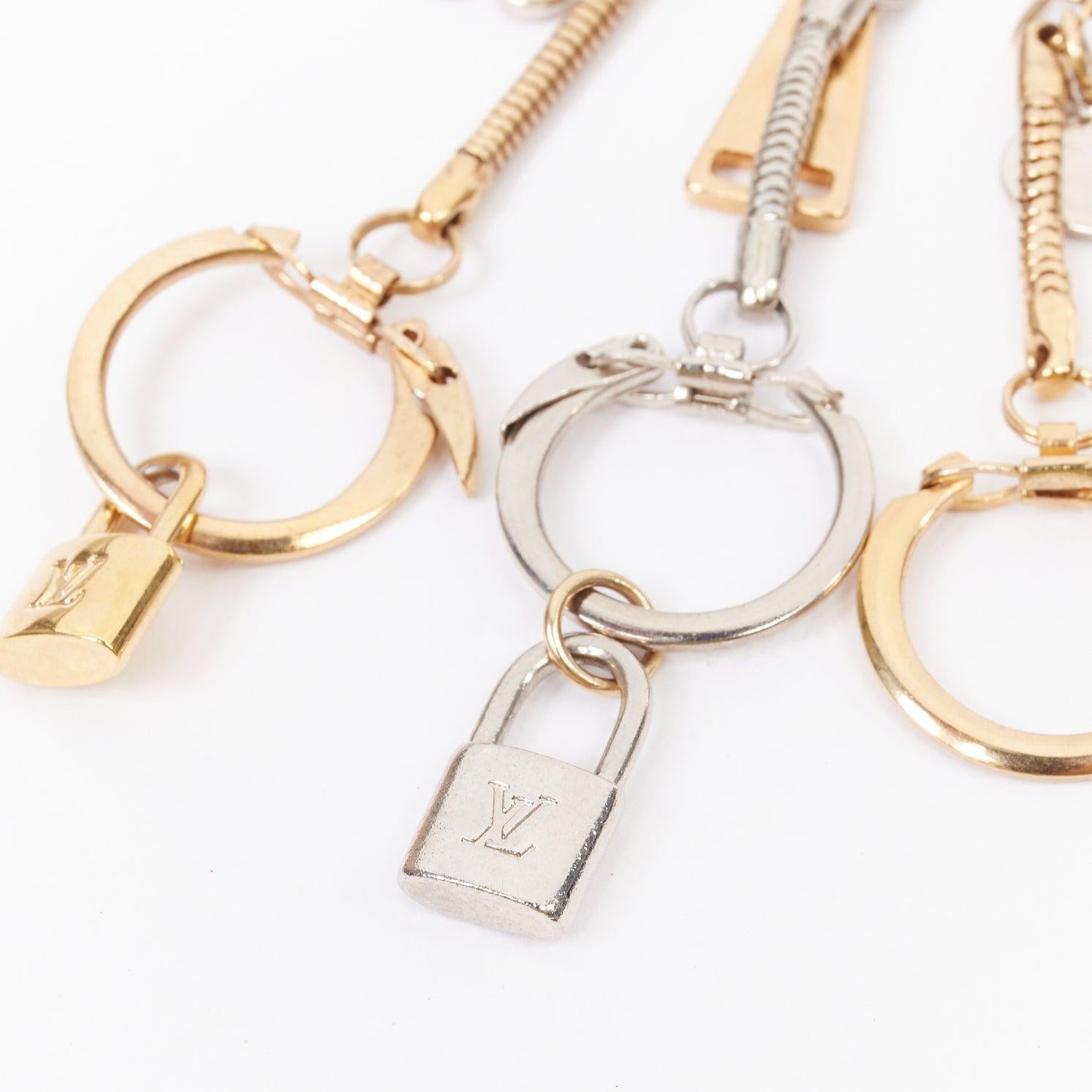 LOUIS VUITTON palladium gold plated safety pin with triple keyring LV lock heart flower charms
Reference: TGAS/E00844
Brand: Louis Vuitton
Material: Metal
Color: Gold, Silver
Pattern: Solid
Closure: Clasp
Extra Details: Gold-Plated, Palladium-Plated