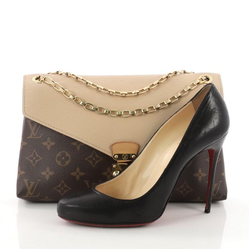 This Louis Vuitton Pallas Chain Shoulder Bag Monogram Canvas and Calf Leather, crafted from brown monogram coated canvas and beige calfskin leather, features dual chain-link strap and gold-tone hardware. Its S-lock closure opens to a beige